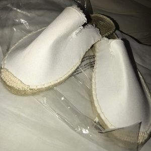 White Canvas Slip On’s